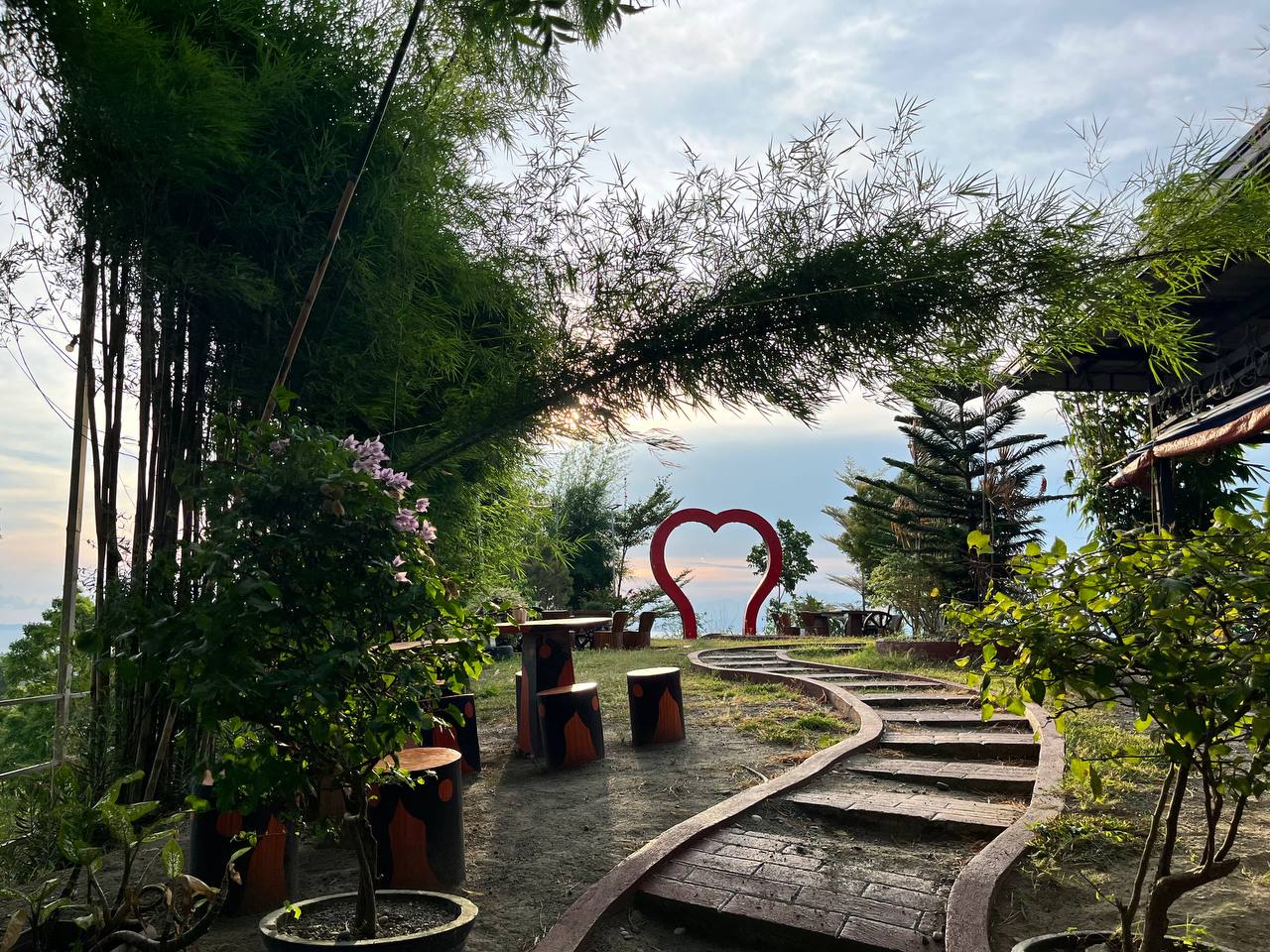 Brick path through the garden leading to the heart arch