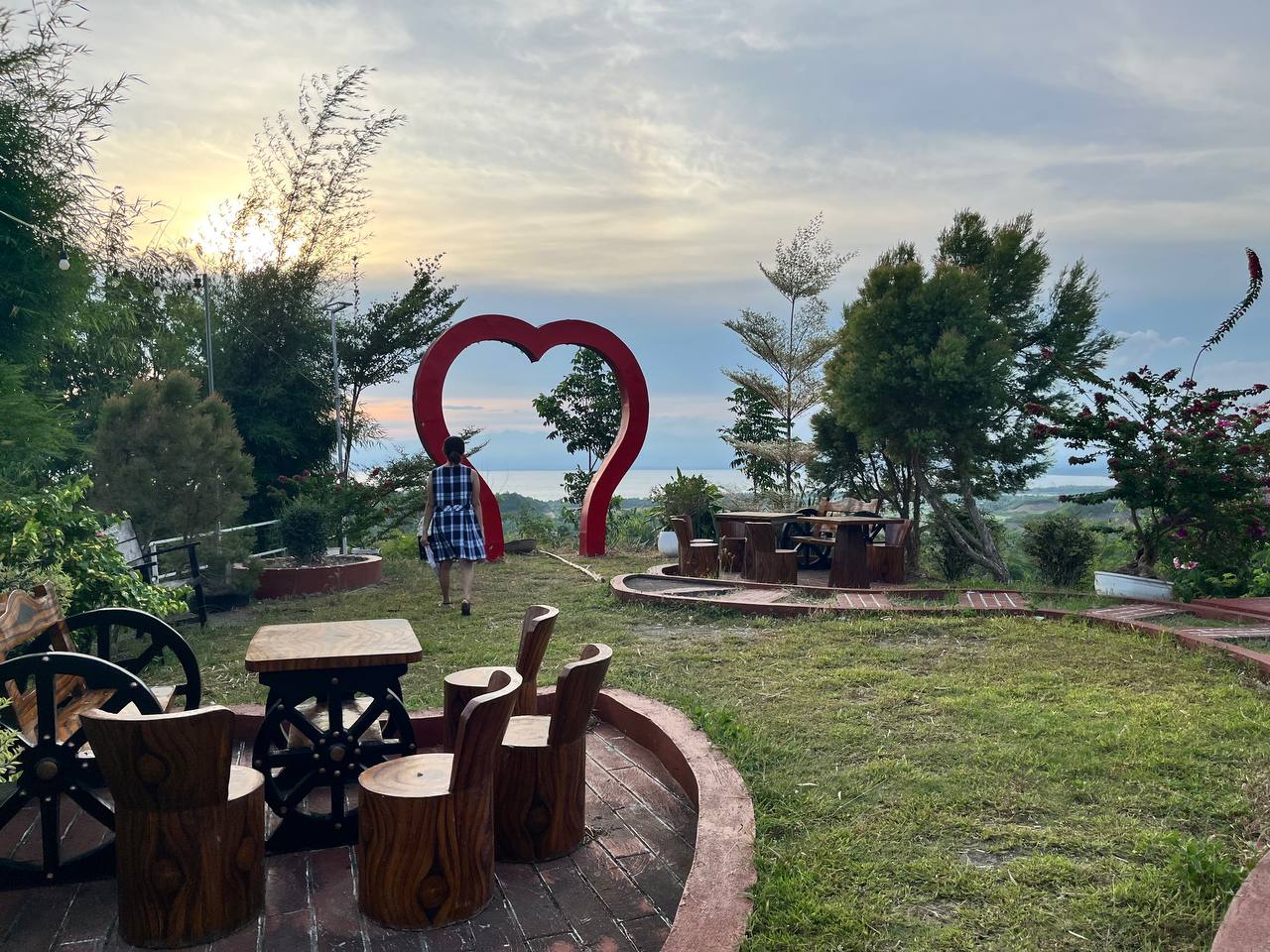 Garden seating and the red heart arch facing the bay